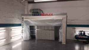 Collapsible paint booth at Chipsaway Smart body shop